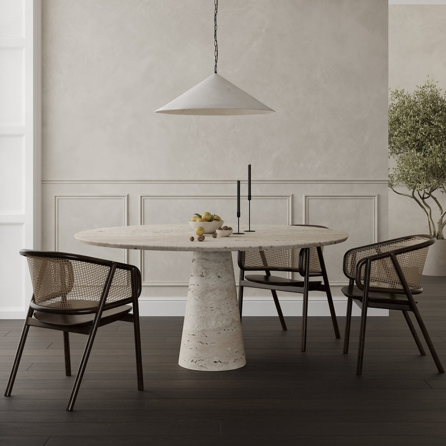 ROMA, the round dining table in Travertine with a tapered pedestal base by Collection Noir. 