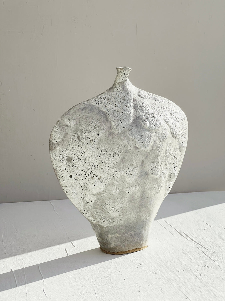 Flat heart shaped ceramic vessel